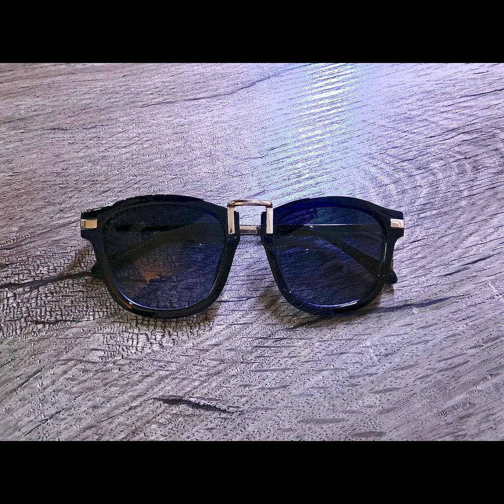 Fashionable black and gold sunglasses